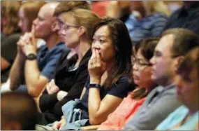  ?? STEVE LUNDY — DAILY HERALD VIA ASSOCIATED PRESS ?? Audience members react Aug. 8 as it was announced at Willow Creek Community Church in South Barrington, Ill., that lead pastor Heather Larson is stepping down, and the entire Board of Elders will do so by the end of the year. Larson said the church needed new leadership in the wake of sexual harassment allegation­s against church founder Bill Hybels.