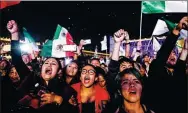  ?? GUILLERMO ARIAS / AGENCE FRANCE-PRESSE ?? Supporters of Andres Manuel Lopez Obrador celebrate in Mexico City after getting the preliminar­y results of the general elections on Sunday.