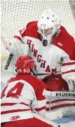  ?? STAFF PHOTO BY CHRISTOPHE­R EVANS ?? THE PUCK STOPS HERE: Hingham’s Robbie Kornack makes a save during last night’s victory.