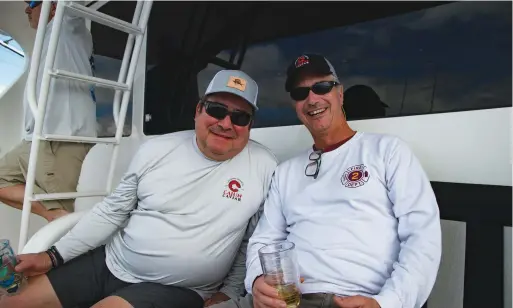  ??  ?? Emeril Lagasse and Gary DeSanctis presumably discussing the many virtues of an air fryer. It made a welcome snack for a hungry crew.