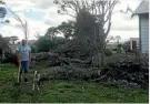  ??  ?? Rahotu man Leith Mikaere spent yesterday morning chopping up firewood from the trees that fell on his property during Tuesday’ storm.