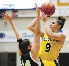  ?? GERRY KAHRMANN ?? The Kelowna Owls’ Taya Hanson shoots over the Walnut Grove Gators’ Natalie Rathler in the final of the triple-A girls’ high school basketball final at the LEC on Saturday in Langley.