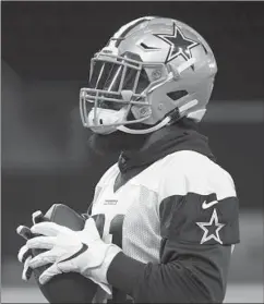  ?? TONY GUTIERREZ/AP ?? RB Ezekiel Elliott was absent from the first day of Cowboys camp in California.