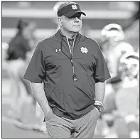  ?? AP file photo ?? Notre Dame Coach Brian Kelly and his staff signed 20 players Wednesday during the first day of the early signing period. The signing period runs through Friday.