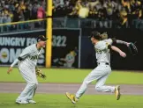  ?? JAE C. HONG/AP ?? Infielder Manny Machado, left, and reliever Josh Hader celebrate after the Padres’ 5-3 series-clinching win over the Dodgers in the NLDS on Saturday night.