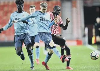  ??  ?? Sunderland’s Benji Kimpioka scraps against Newcastle at the Stadium of Light.