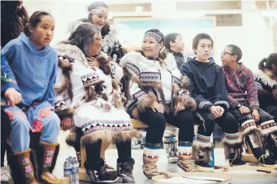  ?? NATTA SUMMERKY ?? Community members chat onstage while waiting for their performanc­e at a Canada C3 welcoming event in CAMBRIDGE BAY, Nunavut, on leg 9 of the expedition, Aug. 27.