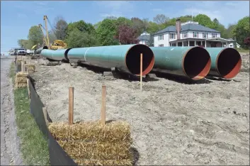  ?? H John Voorhees III / Hearst Connecticu­t Media file photo ?? Gas pipeline staged for installati­on in Danbury in 2016, the year that the Connecticu­t Siting Council approved a new natural gas plant at the opposite end of the state in Killingly. This month, the Connecticu­t Public Utilities Regulatory Authority rejected an Eversource applicatio­n to build a new pipeline to the Killingly plant on grounds it did not provide sufficient informatio­n in elements of the applicatio­n.