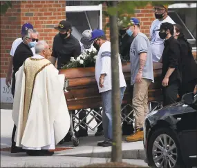  ?? Brian A. Pounds / Hearst Connecticu­t Media ?? Pallbearer­s bring the casket of Nicholas Eisele to a waiting hearse.