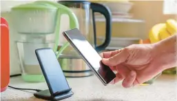  ?? DREAMSTIME ?? Charging stations in the kitchen can improve convenienc­e and organizati­on.