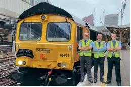  ?? GBRF / Jake Taylor ?? The GBRF Charity Railtours organising team of Ian Grey, Paul Taylor and Dale Williams stand alongside Prostate Cancer Uk-liveried 66769 League Managers Associatio­n, which was used to launch the tour from London Victoria on October 2, 2021.