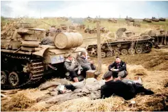  ?? ?? Panzer troops in the winter of 1943 in southern Russia, getting much needed rest next to a Pz.Kpfw.III Ausf.J