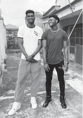  ?? WENDY OLIVER-PYATT/HANDOUT ?? Chidi Solomon Uyaelunmo, right, and older brother Chinedu Victor Uyaelunmo spent part of last summer visiting the home where they grew up just outside of Lagos, Nigeria.