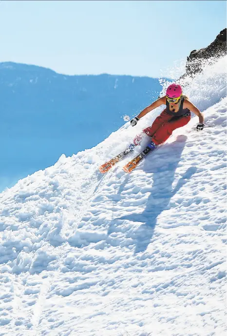  ?? Squaw Valley Alpine Meadows ?? Above: As temperatur­es start to climb in the Sierra, skiers opt for tank tops and T-shirts during the peak slope hours of 10 a.m. to 2 p.m.