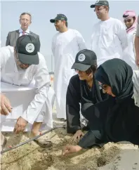  ??  ?? Razan Khalifa Al Mubarak and Adel Ahmed Albuainain planted trees as part of the third phase of the rehabilita­tion programme.