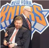  ?? ASSOCIATED PRESS FILE ?? Phil Jackson, standing, and New York Knicks owner James Dolan had high expectatio­ns when Jackson was named team president in 2014. Jackson and the team parted ways Wednesday.