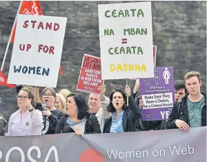  ?? Picture: Getty. ?? Dr Rebecca Gomperts, second right, leads supporters as the abortion rights campaign group ROSA (Reproducti­ve Rights Against Oppression, Sexism and Austerity) hold a rally in Northern Ireland.