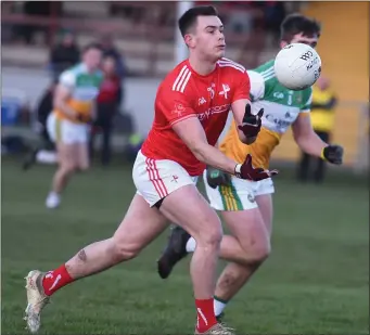 ??  ?? Matt Corcoran of Louth is tracked by Offaly’s Cathal Mangan.