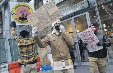  ?? Seth Wenig Associated Press ?? EMPLOYEES ARE seeking better pay, more consistent schedules and higher staffing levels in busy stores. Outlets in 25 states were expected to take part in the labor action. Above, at a store in New York on Thursday.