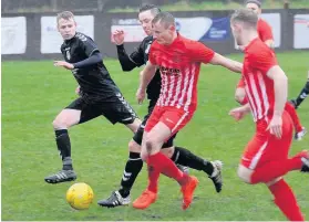  ??  ?? Hard going Barry Devine tries to close down Chris Dallas, who scored Glens’opener