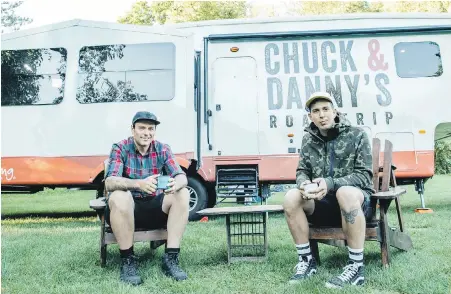  ??  ?? Chuck Hughes, left, and Danny Smiles took to campground­s across Canada for their new Food Network show, Chuck & Danny’s Road Trip.