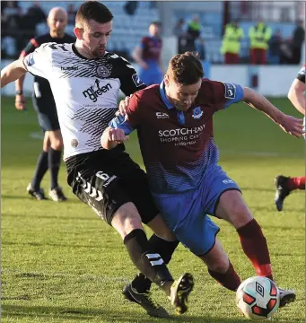  ??  ?? Drogheda United’s Stephen Elliott takes on his man on Saturday. Colin Bell/pressphoto­s.ie