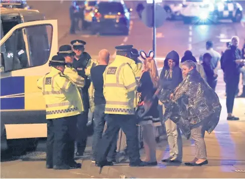  ?? Peter Byrne / PA ?? Emergency services at Manchester Arena after the terror attack during an Ariana Grande gig on Monday evening