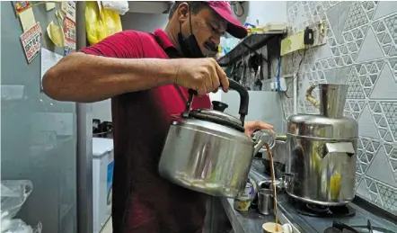  ?? — ap ?? an Indian tea seller who gave his name as Rafik pours karak in dubai, united arab emirates.