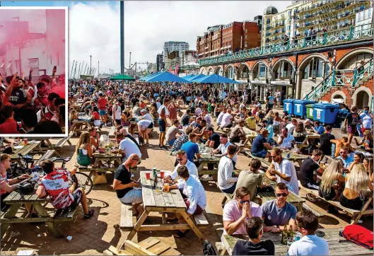  ??  ?? PACKED: Weekend crowds soaking up the sun at cafes and bars on the beachfront at Brighton yesterday– but with little sign of social distancing