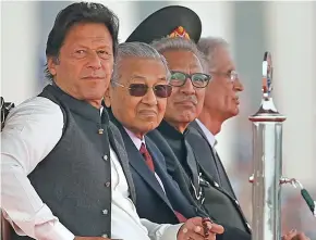  ?? Photo: AP ?? From left: Pakistan Prime Minister Imran Khan, Malaysian Prime Minister Mahatir Mohamad and President Arif Alvi attend the Pakistan Day military parade in Islamabad on March 23, 2019.