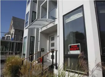  ?? PAul cONNOrs / bOsTON HErAld FIlE ?? EMPTYING OUT: A ‘For Rent’ sign is displayed in the window of an apartment in Allston on Oct. 10. With the state eviction moratorium expiring on Oct. 17, evictions are expected to skyrocket, though a federal ban will allow tenants to stay through the end of the year while landlords process their eviction paperwork.