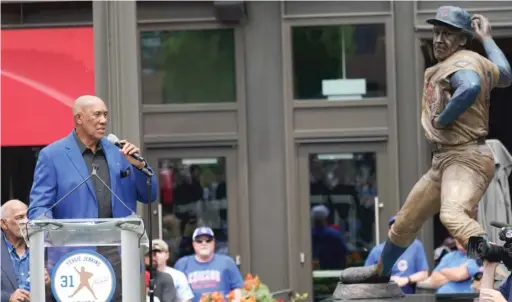  ?? NAM Y. HUH/AP ?? Hall of Fame pitcher Fergie Jenkins looks at the statue unveiled in his honor Friday while delivering remarks outside Wrigley Field.