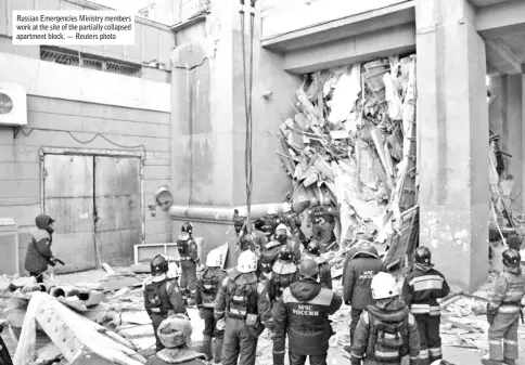  ??  ?? Russian Emergencie­s Ministry members work at the site of the partially collapsed apartment block. — Reuters photo