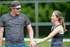  ?? SARAH GORDON/THE DAY ?? Mixed doubles teammates Stefan Jones and Jill Leggier celebrate a point during the Stonington Open on Sunday at Stonington High.