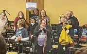  ?? ?? Audience members at the Ohio Redistrict­ing Commission meeting Wednesday chant “Fair maps now!” after the commission adjourned without action.