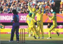  ?? AP ?? Australia celebrates a wicket against India in the women’s cricket T20 final at the Commonweal­th Games in England on Sunday.