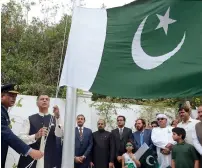  ??  ?? Moazzam Ahmad Khan leading the flag hoisting ceremony held at the Pakistani Embassy in Abu Dhabi.