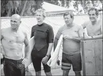  ??  ?? KELLY SLATER and fellow champions, from left, Mark Richards, Wayne Bartholome­w and Shaun Tomson look on.