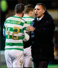  ??  ?? Brendan Rodgers congratula­tes penalty-winner Callum McGregor at the full-time whistle after Celtic took a point