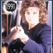  ??  ?? 1991 Jackie Ingram (Shirin Taylor) holds Mike Baldwin (Johnny Briggs) at gunpoint