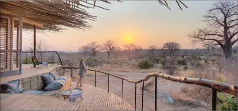  ?? Photo contribute­d ?? A visitor on an African safari enjoys a stunning view from her room deck.