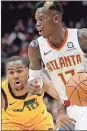  ??  ?? Atlanta’s Dennis Schroder (right) dribbles against Utah’s Alec Burks in the third quarter in Atlanta.