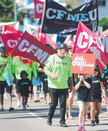  ?? ADVOCACY: Unions flex their muscle at the annual Labour Day march. ??