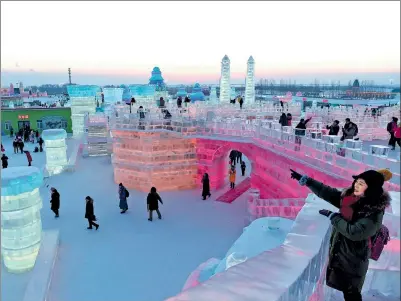 ?? XINHUA ?? Tourists visit the Ice and Snow World in Harbin, capital of Heilongjia­ng province.