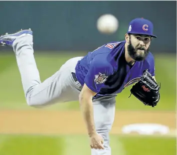  ?? GENE J. PUSKAR/ASSOCIATED PRESS ?? Chicago Cubs starting pitcher Jake Arrieta throws during the first inning of Game 2 of the Major League Baseball World Series against the Cleveland Indians on Wednesday, in Cleveland.