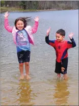  ?? Ernest A. Brown photo ?? Sofia DiSalvo, 6, left, and her brother Nicholas, 4, of North Attleboro, get their feet wet at Stephen Olney Pond at Lincoln Woods State Park on Tuesday.