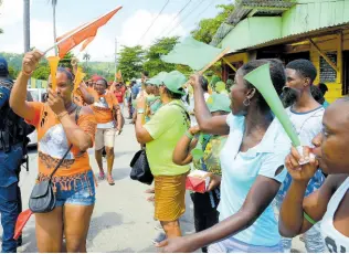  ?? FILE ?? In this 2019 photo, PNP and JLP supporters are seen in Port Antonio, Portland.