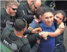  ??  ?? Memphis police arrest Manuel Duran, the reporter for Spanish-language media during a Memphis protest April 3. He has now been detained 58 days, but has won a stay of deportatio­n for now. JIM WEBER / THE COMMERCIAL APPEAL