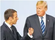  ?? ASSOCIATED PRESS FILE PHOTO ?? France’s President Emmanuel Macron talks with U.S. President Donald Trump after the family photo on the first day of the G-20 summit in Hamburg, Germany, earlier this month. The two leaders will look for common ground on terrorism and defense policy...