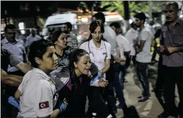  ?? — GETTY IMAGES ?? A mother of a victim cries for her son following an attack on a Turkish cultural centre that killed at least 31 people and wounded nearly 100 on Monday.